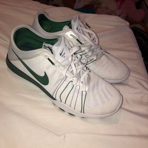 Green and white Nike free